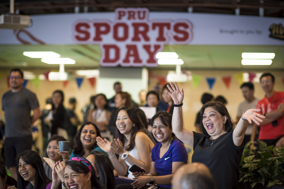 Lead policy writer, Noreen Wee, 63, and colleagues participating in Prudential’s ‘Sports Day’ activities